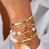 Scarpe E Accessori Charlotte (tianjin) International Trading Co., Ltd | Set Di Quattro Bracciali Con Perline Decorative, Colore Oro